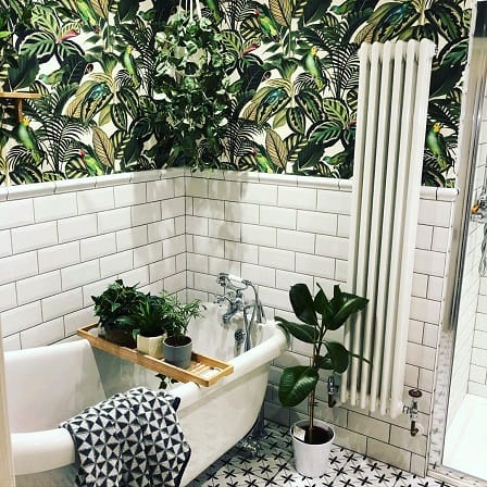 a vertical column radiator in a traditional bathroom space a vertical column radiator in a traditional bathroom space