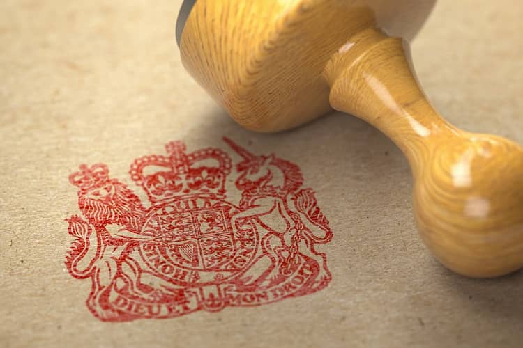 United Kingdom coat of arms stamp with rubber stamp on craft paper