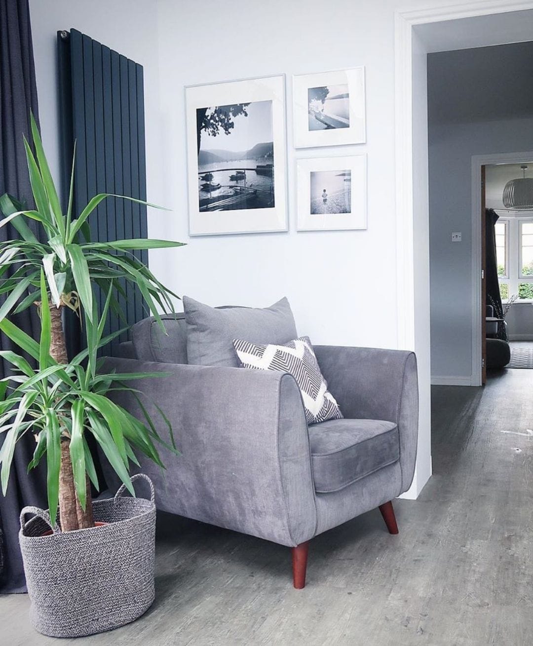 vertical anthracite radiator behind an arm chair