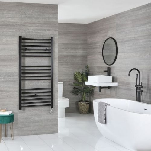 milano nero wall mounted electric heater in a grey bathroom