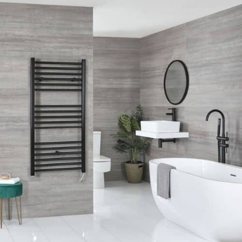 milano nero wall mounted electric heater in a grey bathroom