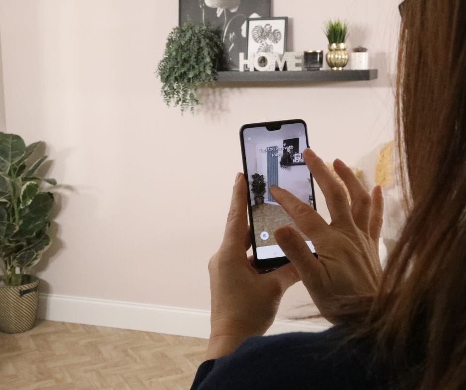 woman using the augmented reality tool woman using the augmented reality tool