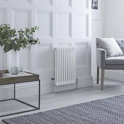 small white column radiator in a living room