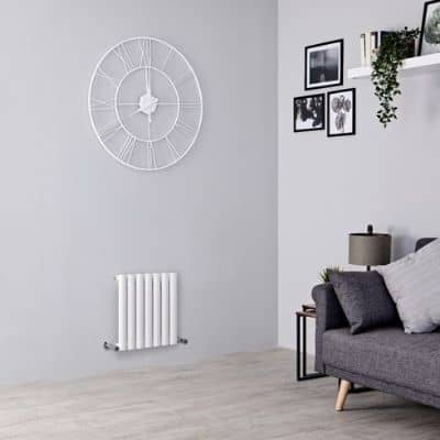 small aruba radiator in a grey living room
