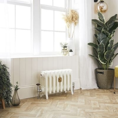 small cast iron radiator in a bathroom