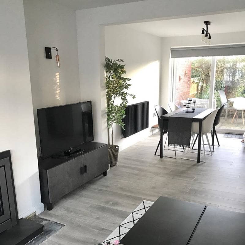 Milano Windsor anthracite radiator in a white living room