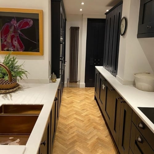 bronze vertical radiator in a modern kitchen
