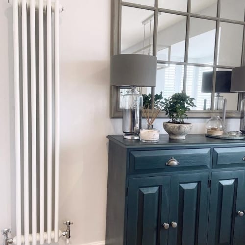 white vertical column radiator in a period home
