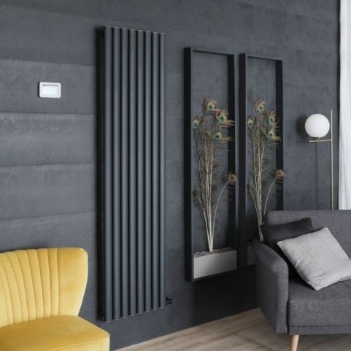 milano aruba ardus electric vertical radiator in a grey living room