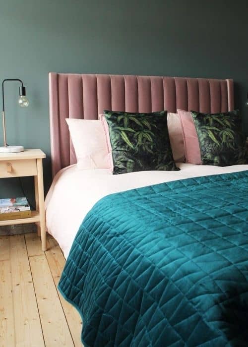 bed with a pink headboard