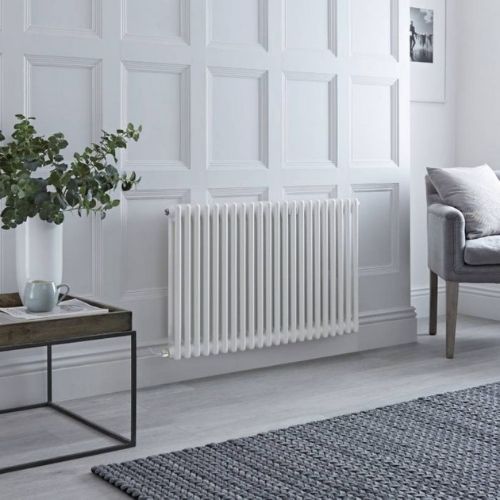 milano windsor electric column radiator in a grey living room