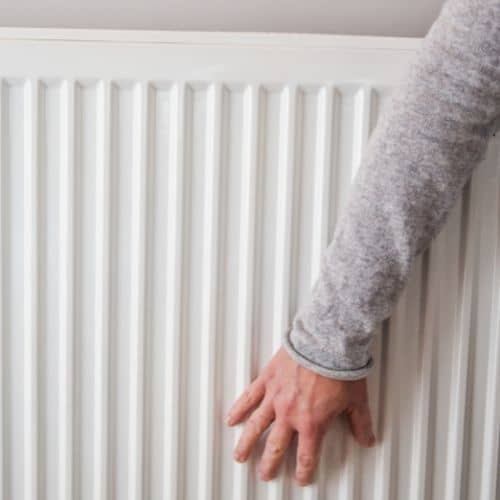 hand on the bottom of a radiator