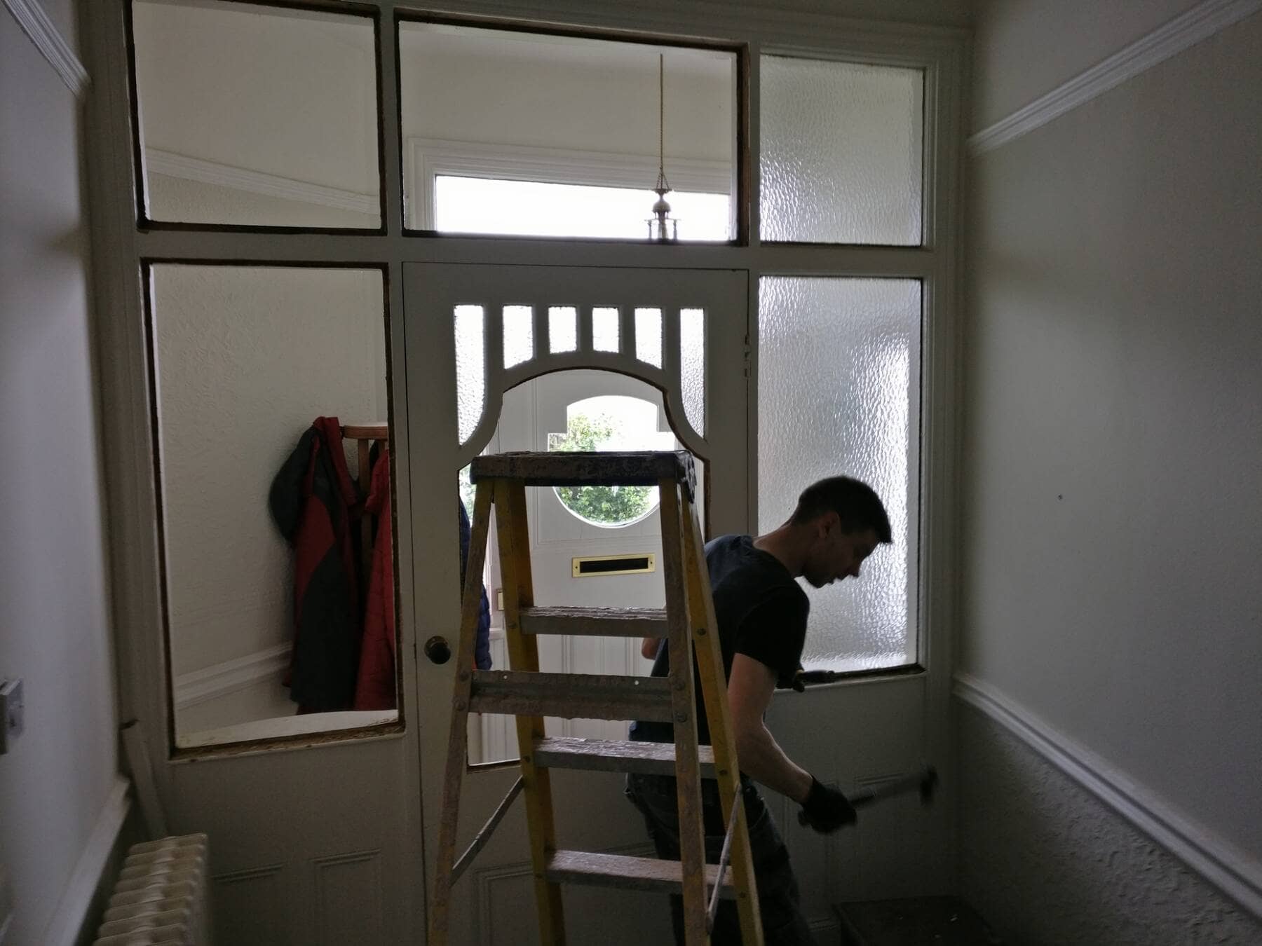 man decorating in a house
