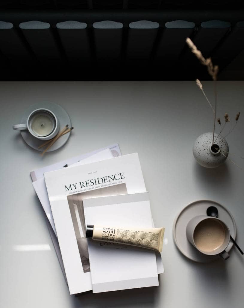 Cup of tea next to interior design booklets