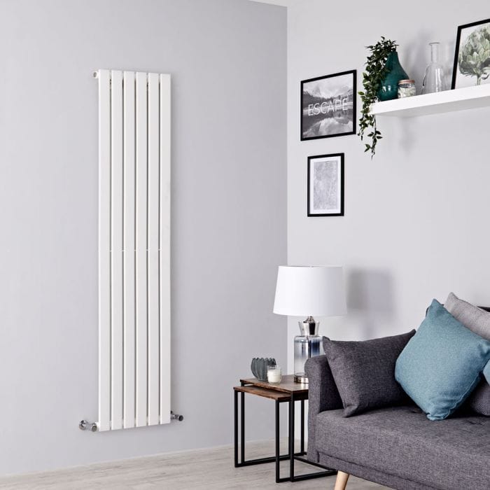 an image of a tall white vertical radiator in a sitting room