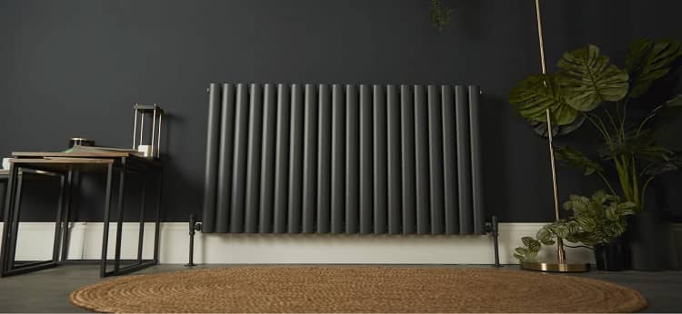 white designer rad grey radiator in a dark sitting room