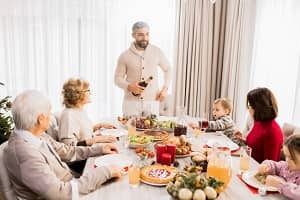 a family sat around the dinner table at christmas a family sat around the dinner table at christmas