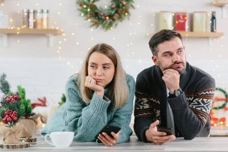 a young couple embarrassed about hosting christmas dinner
