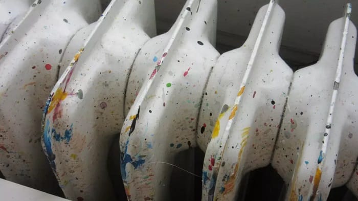 Traditional white cast iron radiator with paint splashes a radiator with paint splashes all over the top of it