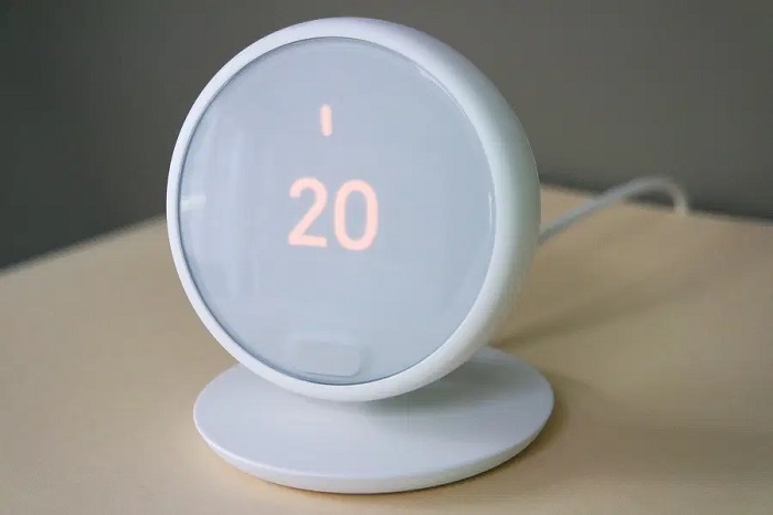a white wired room thermostat