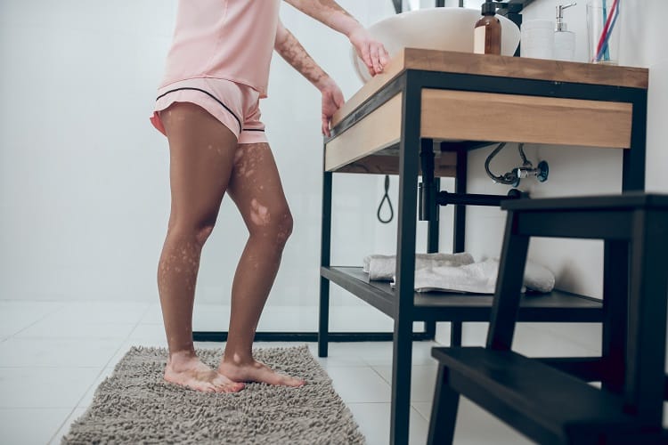 In a bathroom. A close up of a woman in pink lingerie in a bathroom In a bathroom. A close up of a woman in pink lingerie in a bathroom