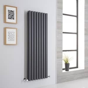 Tall anthracite vertical radiator a grey designer radiator in a sitting room