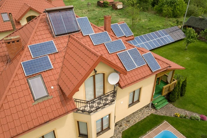 Aerial view of large house with multiple solar panels Aerial view of large house with multiple solar panels