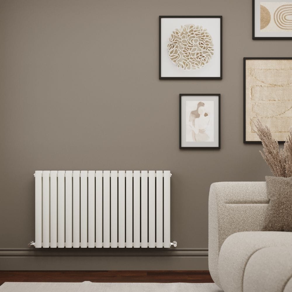 Milano Aruba Ayre white aluminium double panel horizontal designer radiator on light brown background nearby multiple framed art pictures and light settee