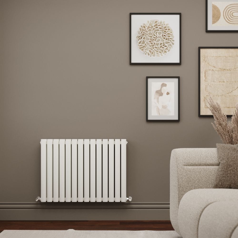 Milano Aruba Ayre aluminium white horizontal double panel designer radiator on light brown wall nearby cream settee and multiple pieces of framed artwork