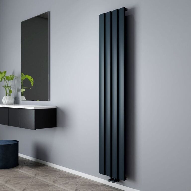 Milano Aris aluminium black vertical designer radiator on light background in modern interior nearby floating black and white vanity unit with houseplant and mirror