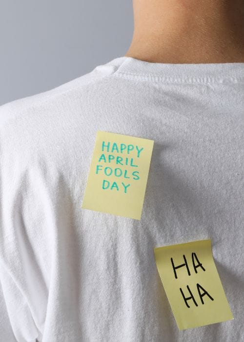 man with april fools sticker on his back
