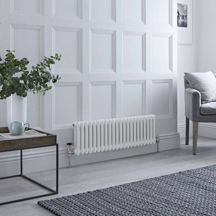 small low level Windsor column radiator in a small living room