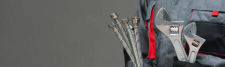 plumber holding tools