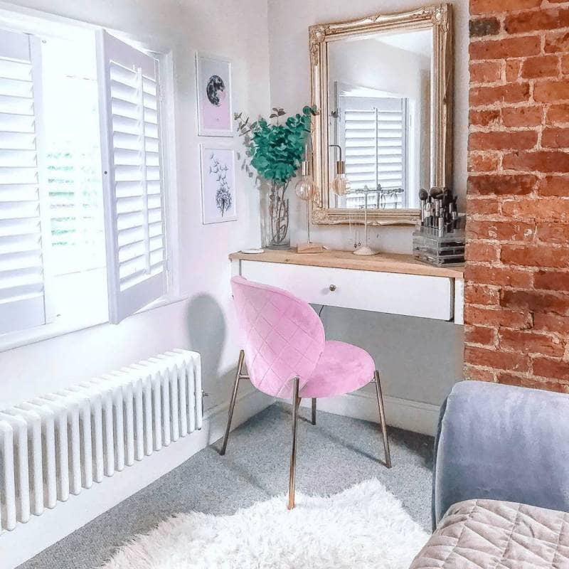 Low level Milano Windsor column radiator in a dressing room