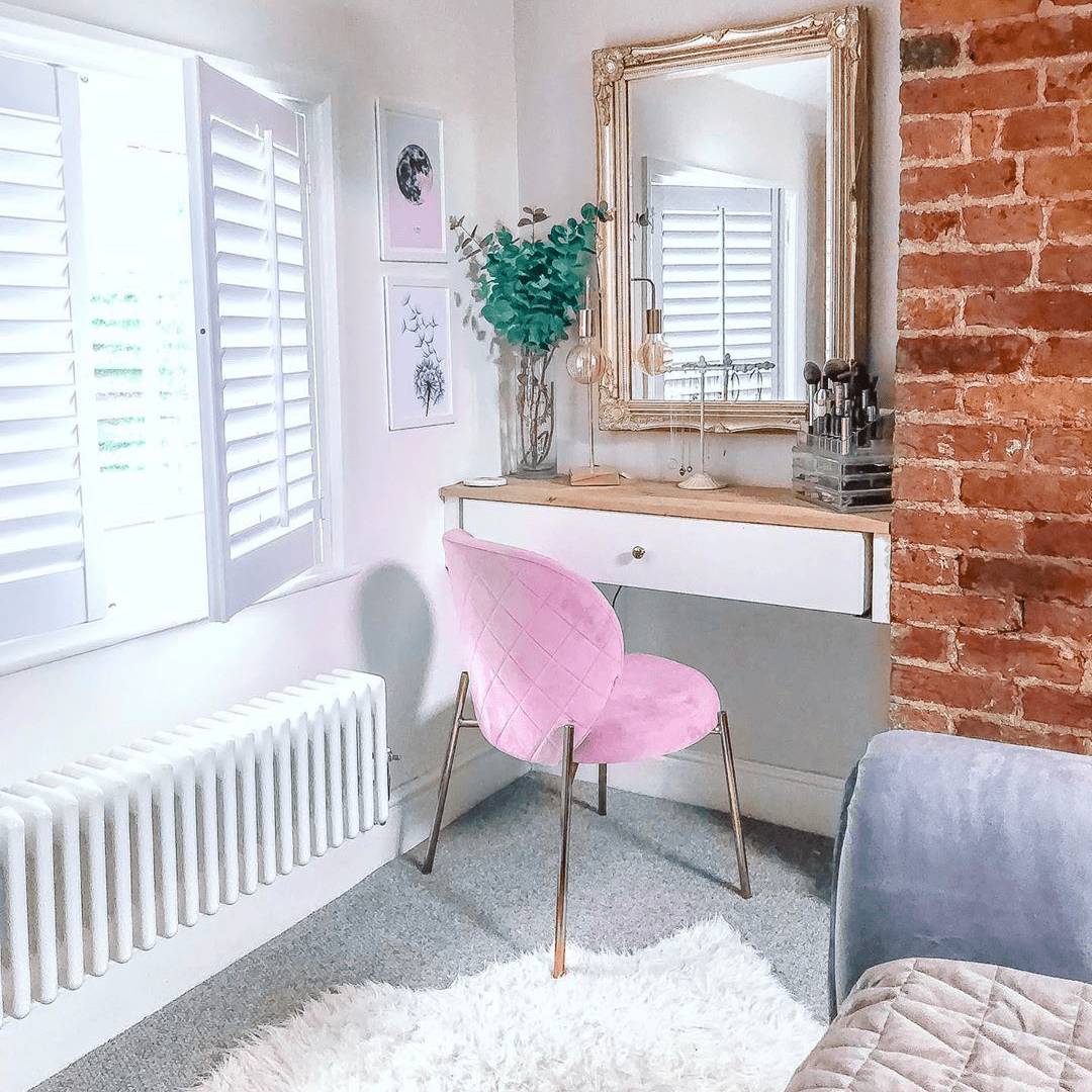 Low level Milano Windsor column radiator in a dressing room