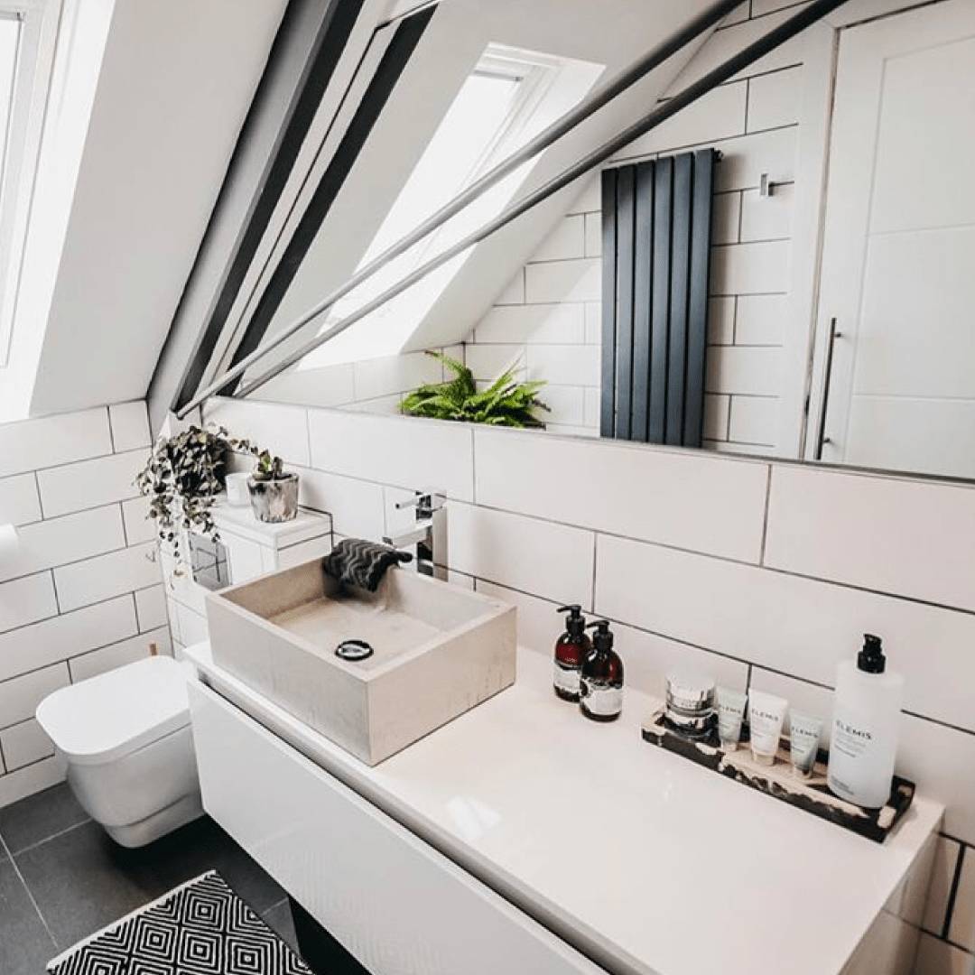 Milano Capri vertical radiator in a bathroom