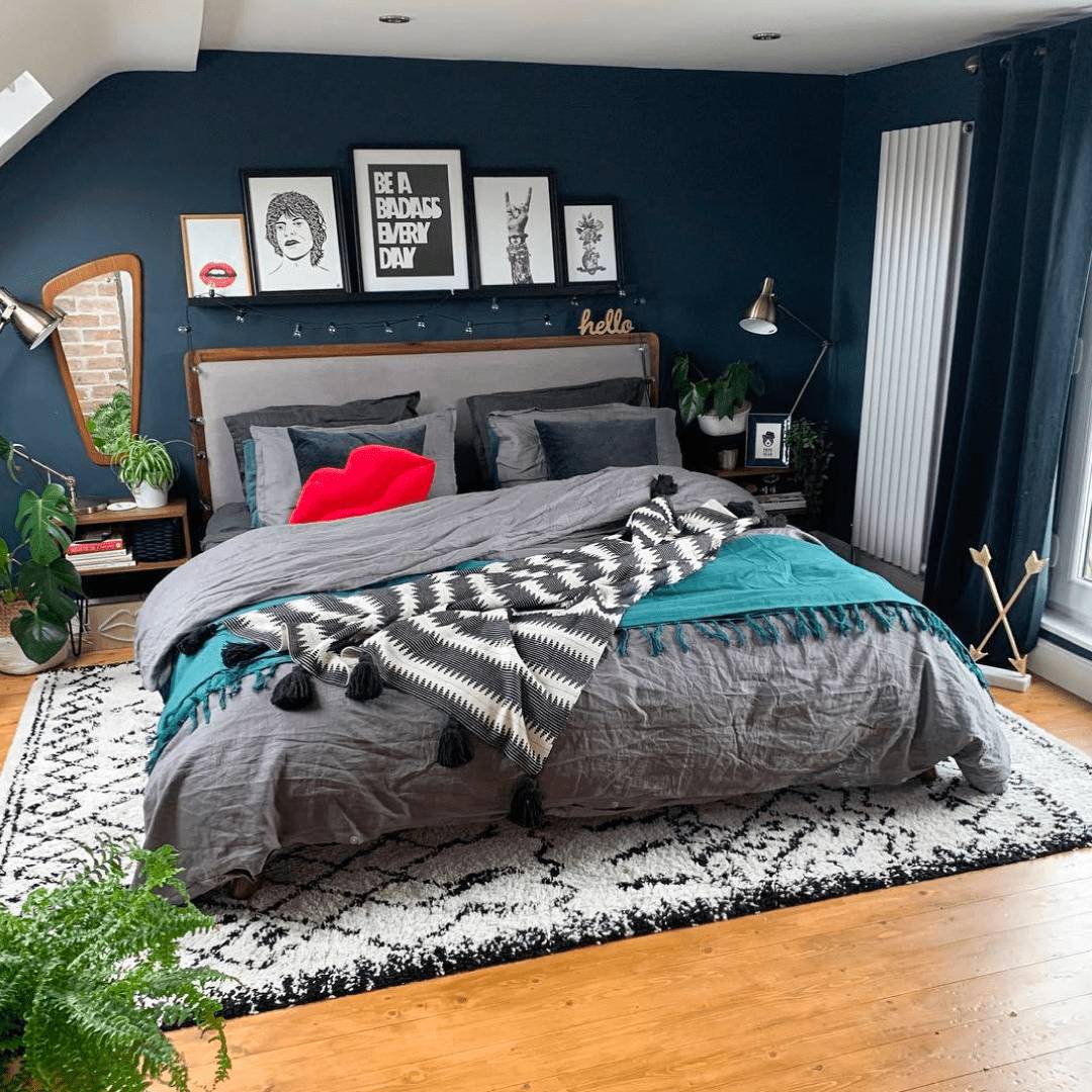 Milano Aruba white vertical radiator in a navy bedroom
