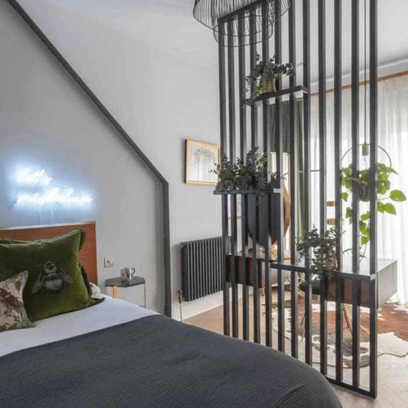 Milano Windsor anthracite radiator in a bedroom