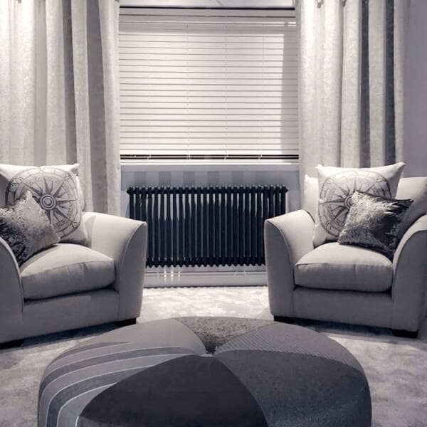 Milano Windsor anthracite radiator in a grey living room