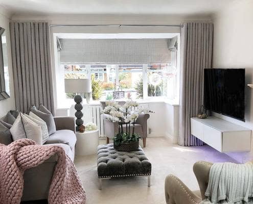 White Milano Alpha radiator in a pink and grey living room