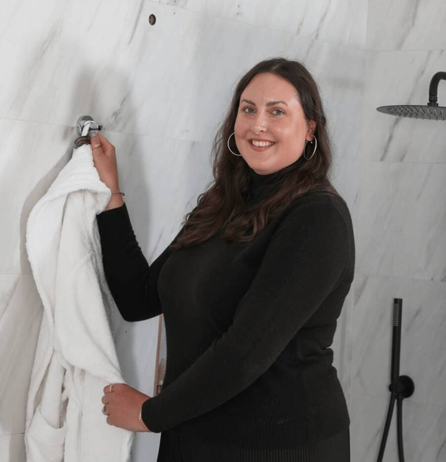 Jess Steele standing in a bathroom space