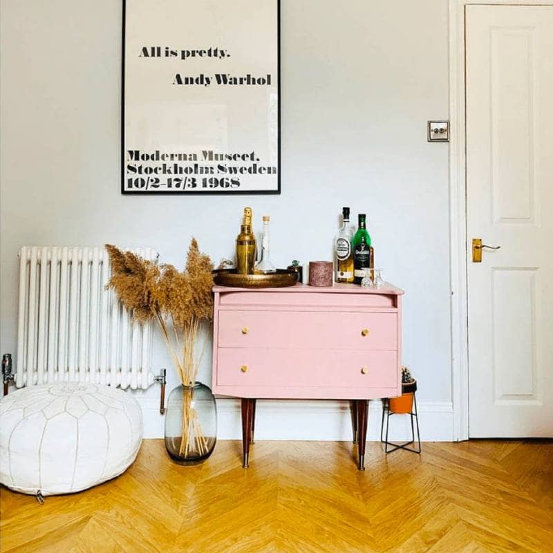 Milano Windsor column radiator next to a pink bar cart