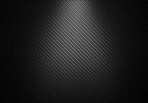 Carbon fibre material Close up of black carbon fibre material
