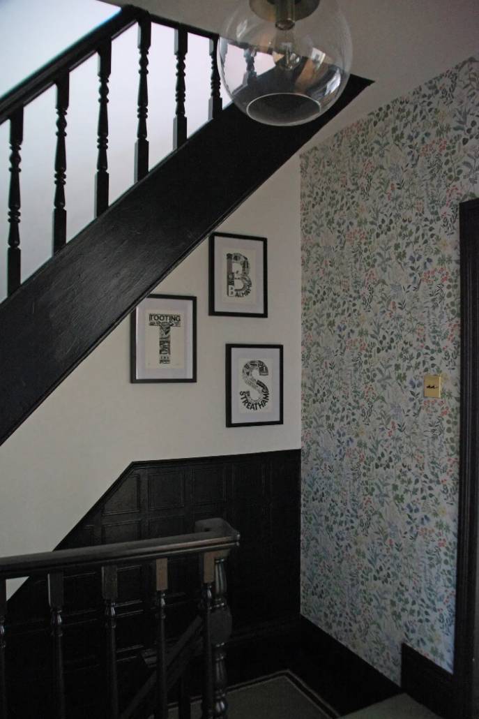 black staircase with a gallery wall