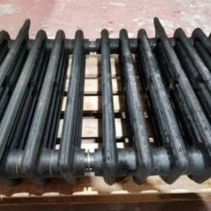 Step 3 cast iron radiators being assembled