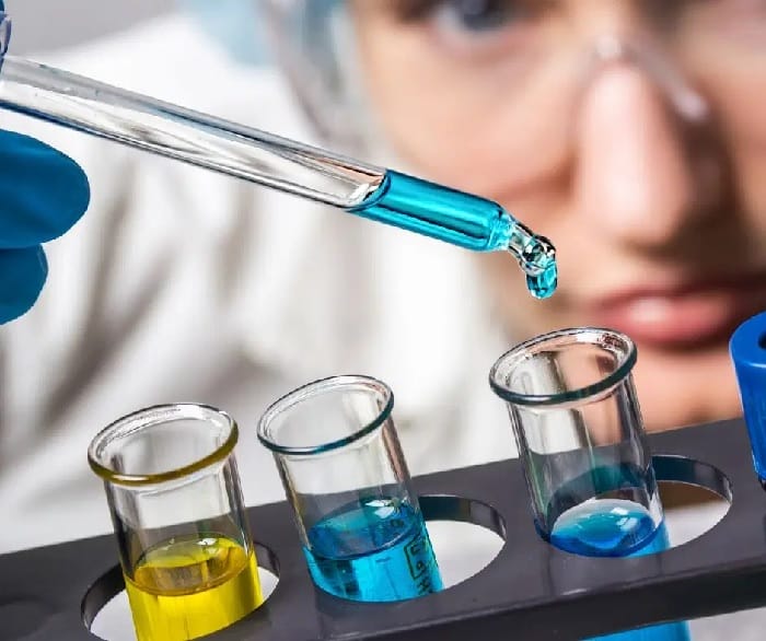 chemicals in test tubes Chemicals dropping into test tube
