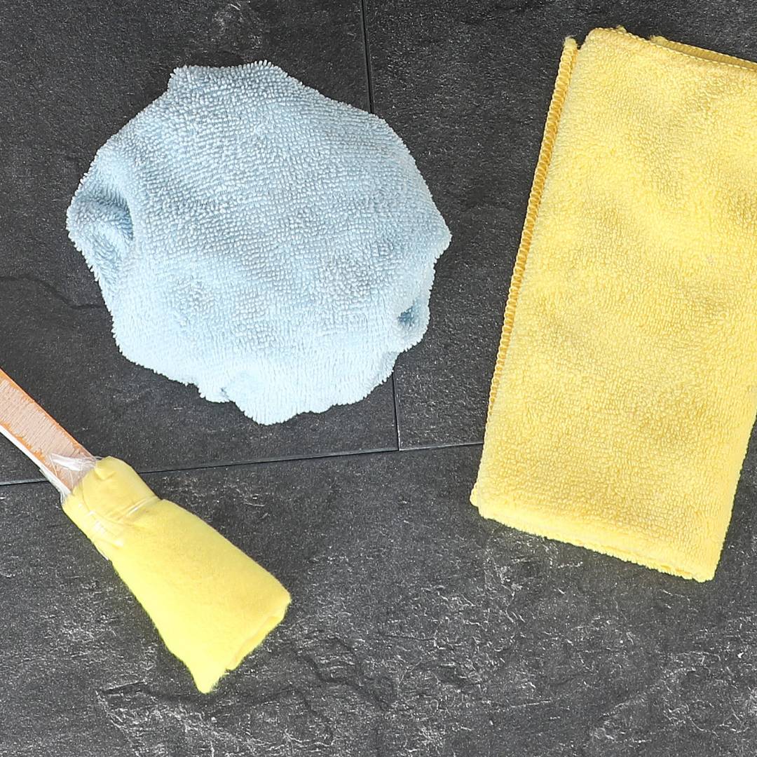 radiator brushes and cloths on a tile floor
