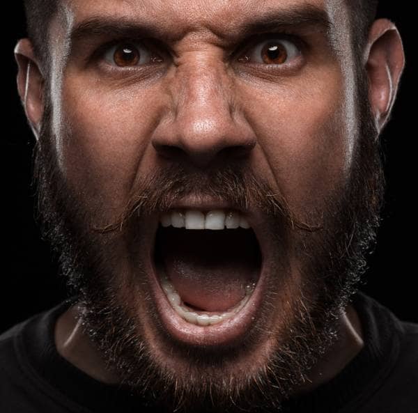 Angry man screaming into the camera
