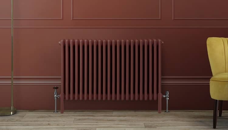 a red radiator on a matching wall