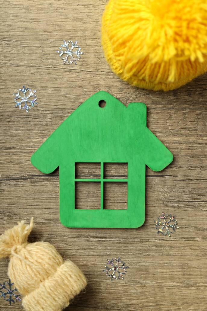 Green home concept on wooden background